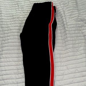 Black leggings with red stripes on the side